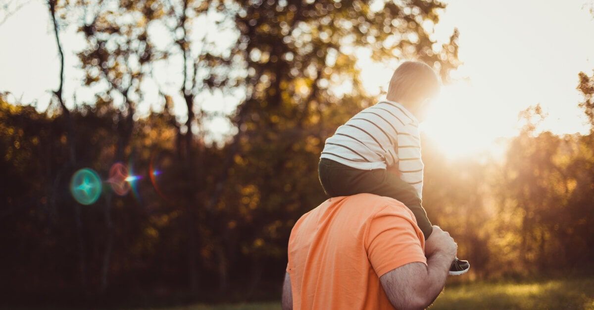 boy on his dad's shoulders