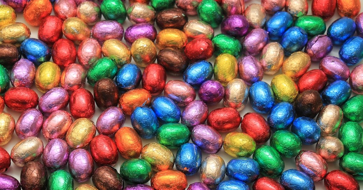 photo of a pile of different coloured chocolate easter eggs