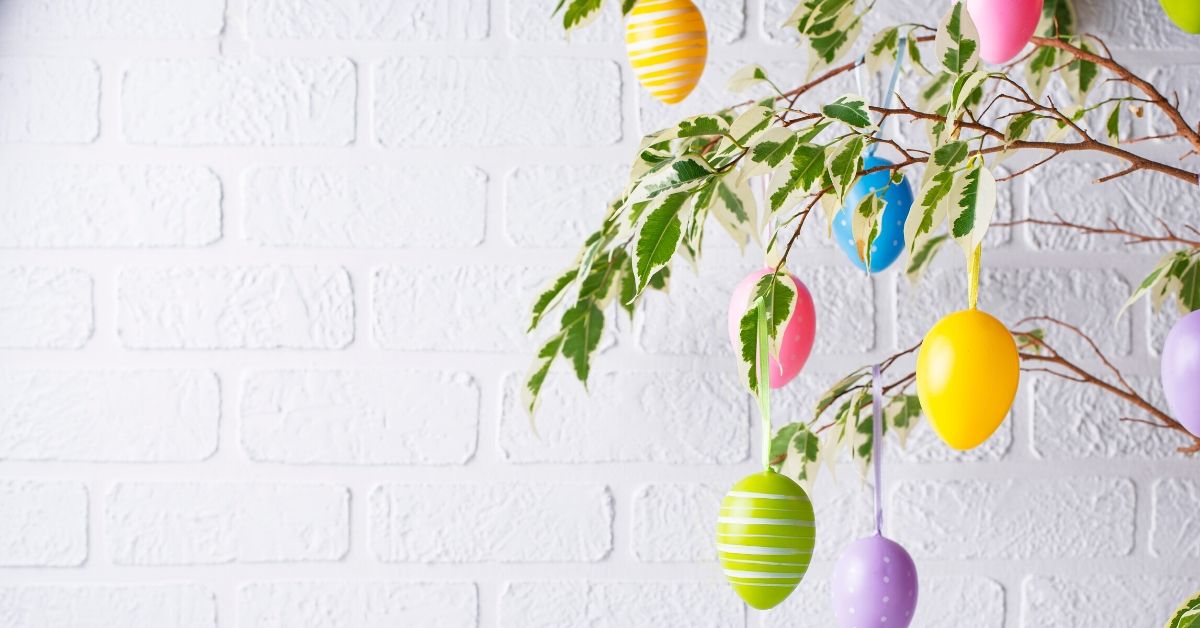 photo of easter eggs hanging on a tree