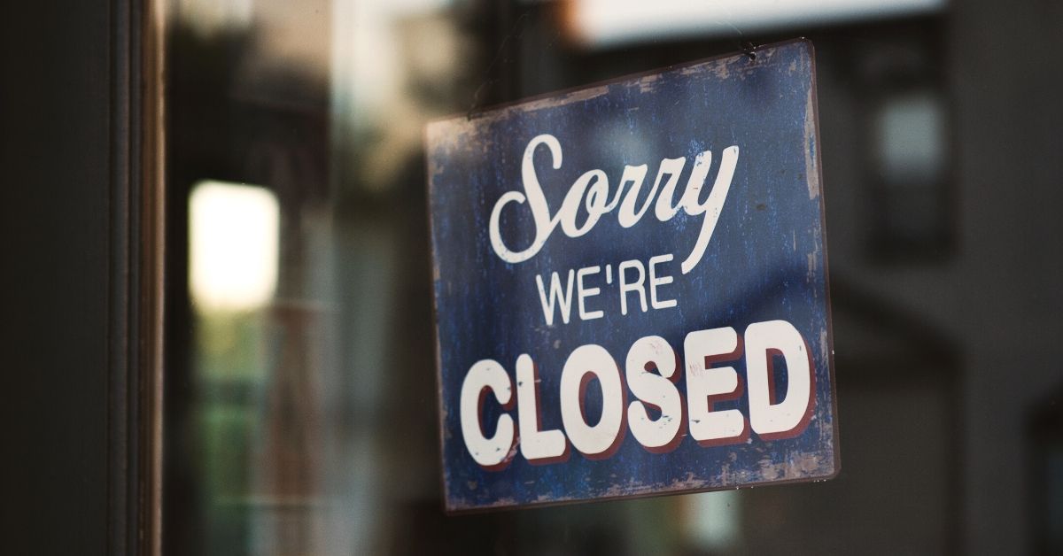 photo of a sign hanging on the glass of a shop which says sorry we're closed. People may no longer assume they will have accessibility to everything they want and need after covid-19
