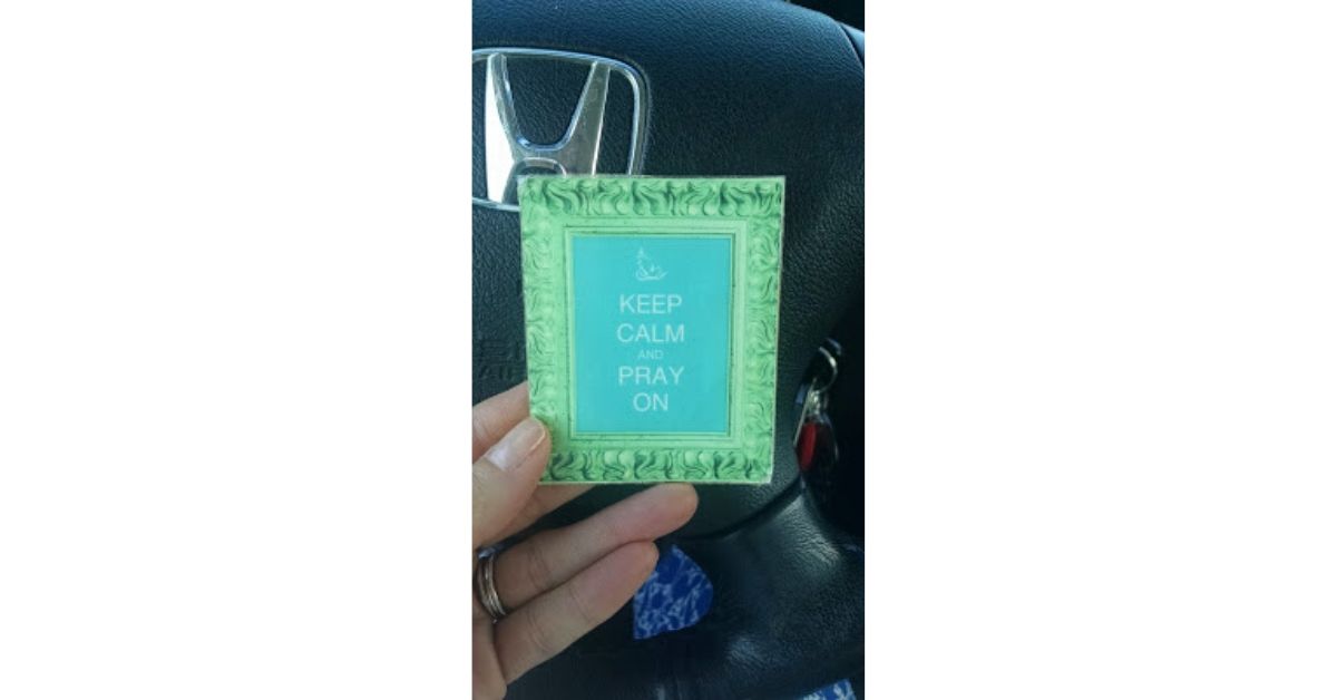 card which says keep calm and pray on