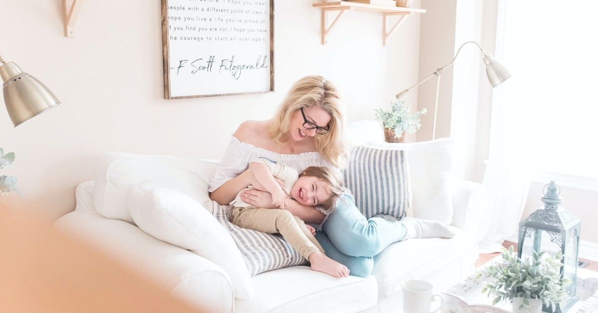 mum and daughter playing together laughing