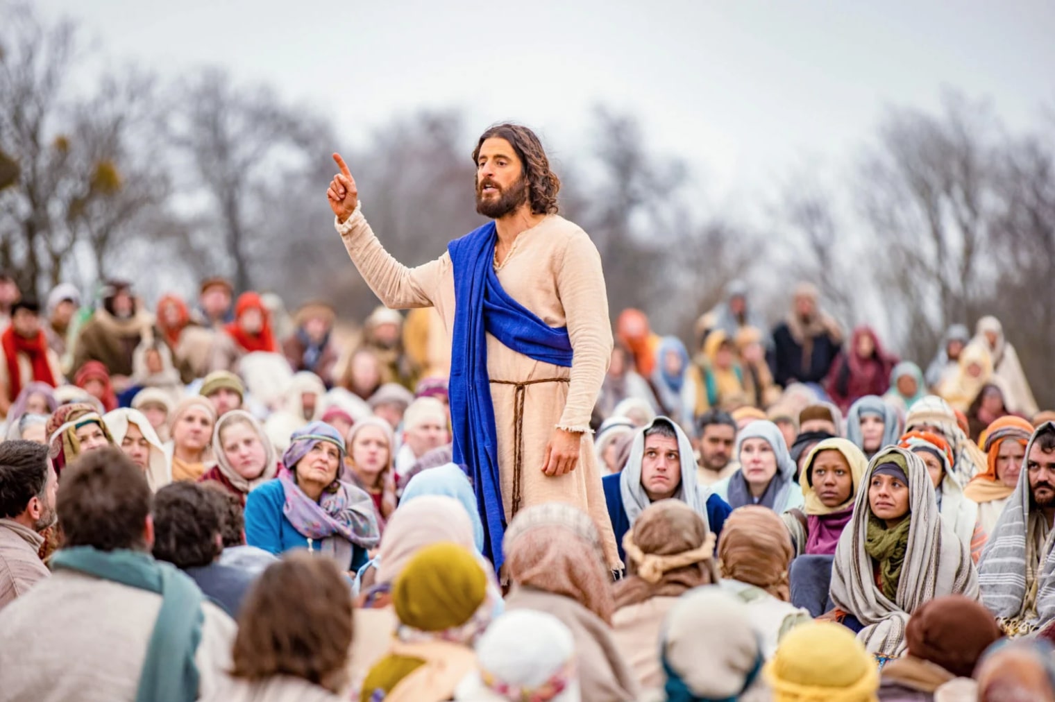 film still from the chosen - jesus speaks to a crowd