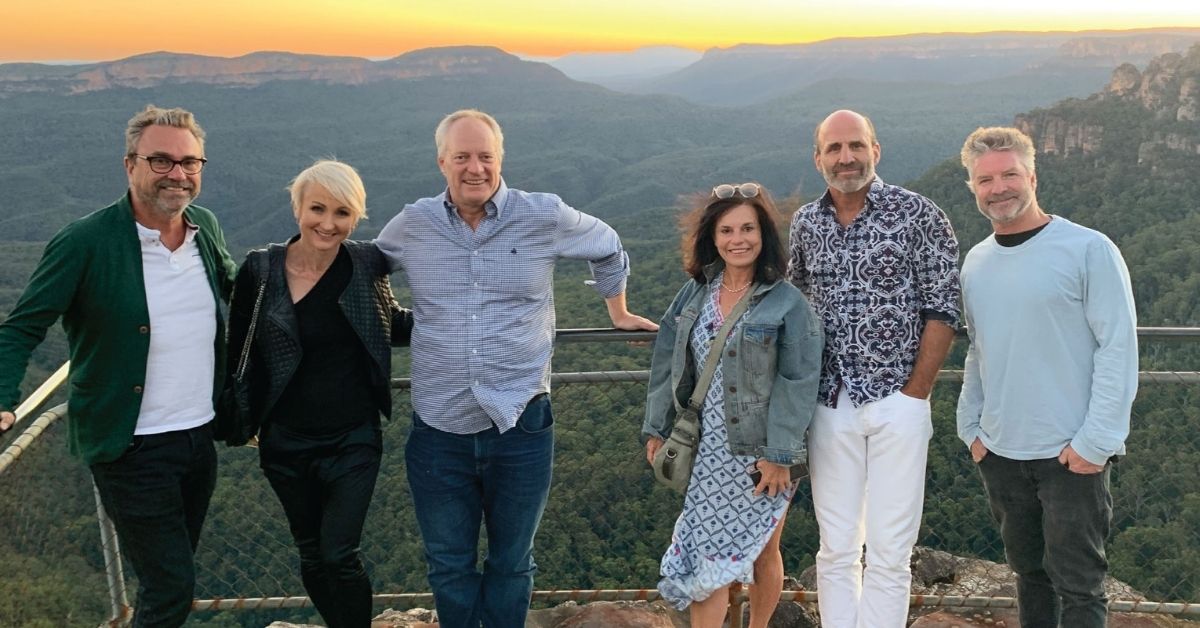 middle aged people posing at the blue mountains