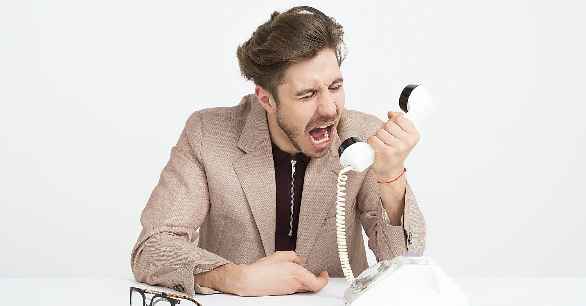 Man frustrated on phone