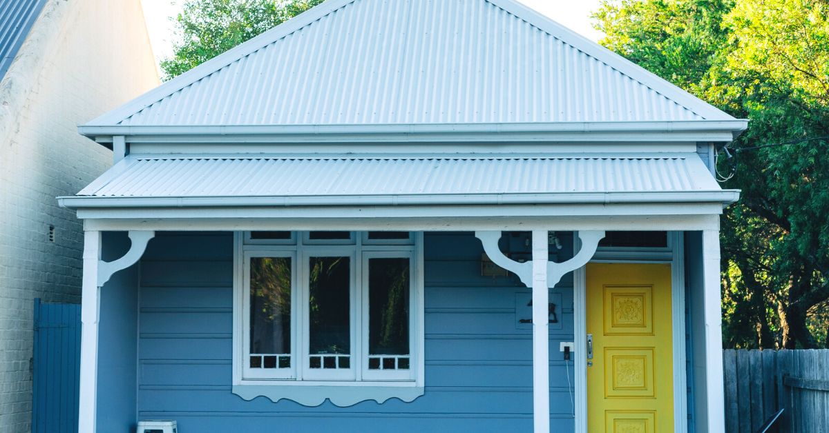 Blue cottage with yellow door