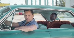 Tony Lip driving Dr Don Shirley in Green Book.