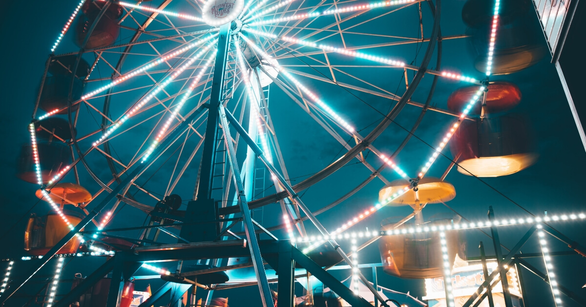 a ferris wheel at night time