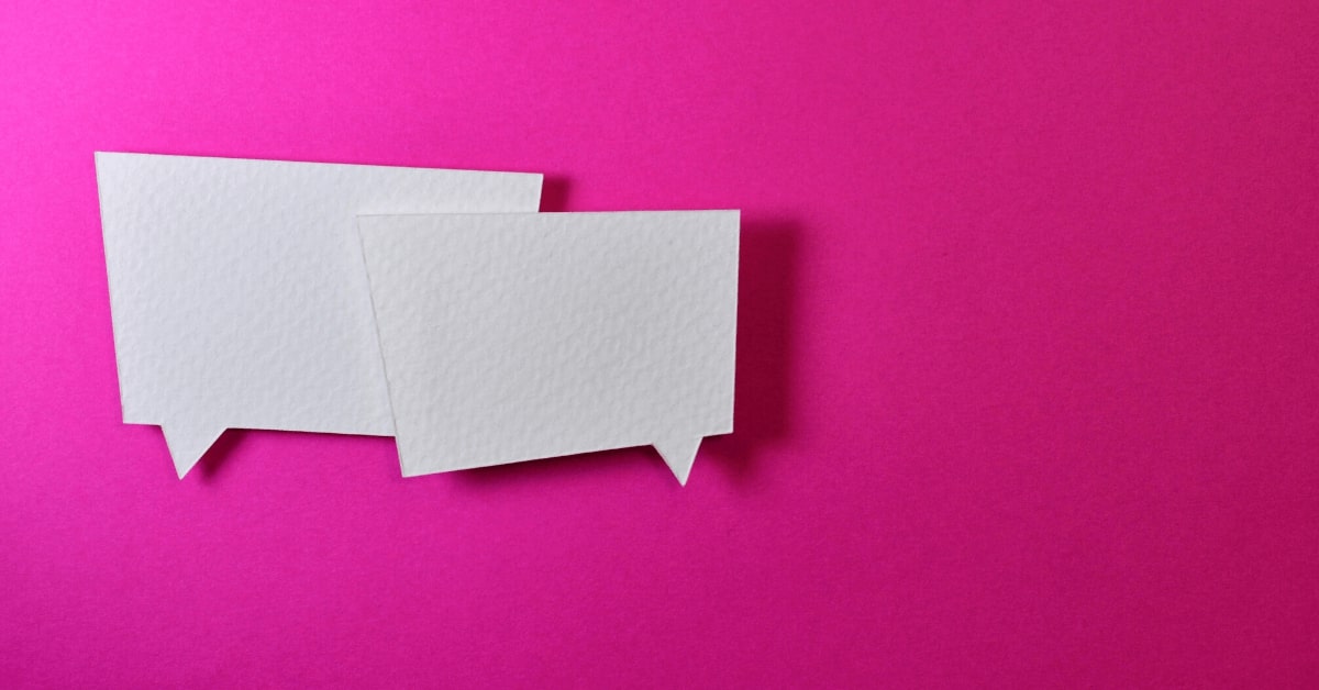 two speech bubbles on bright pink background