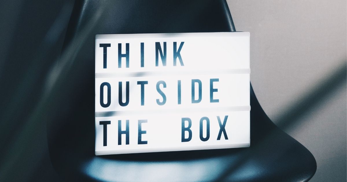 photo of a lightbox which reads "think outside the box"