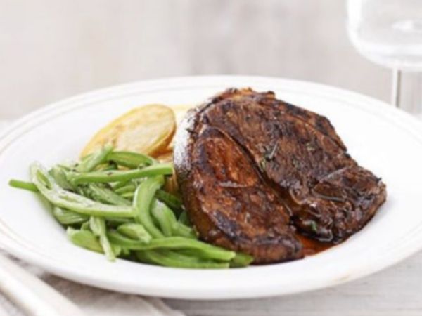 photo of lamb steak and potato on a plate
