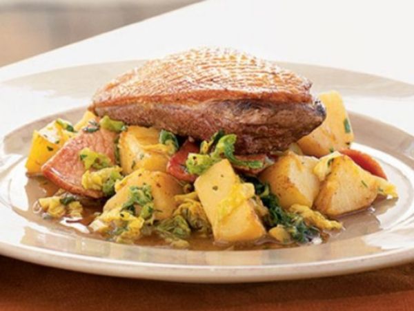 photo shows a plate with simmered duck, cabbage and potatoes