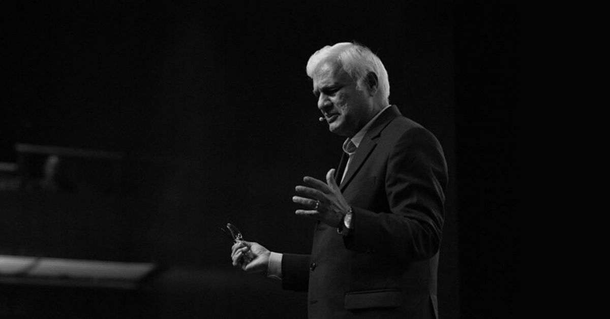 black and white photo of ravi zacharias speaking at a lectern