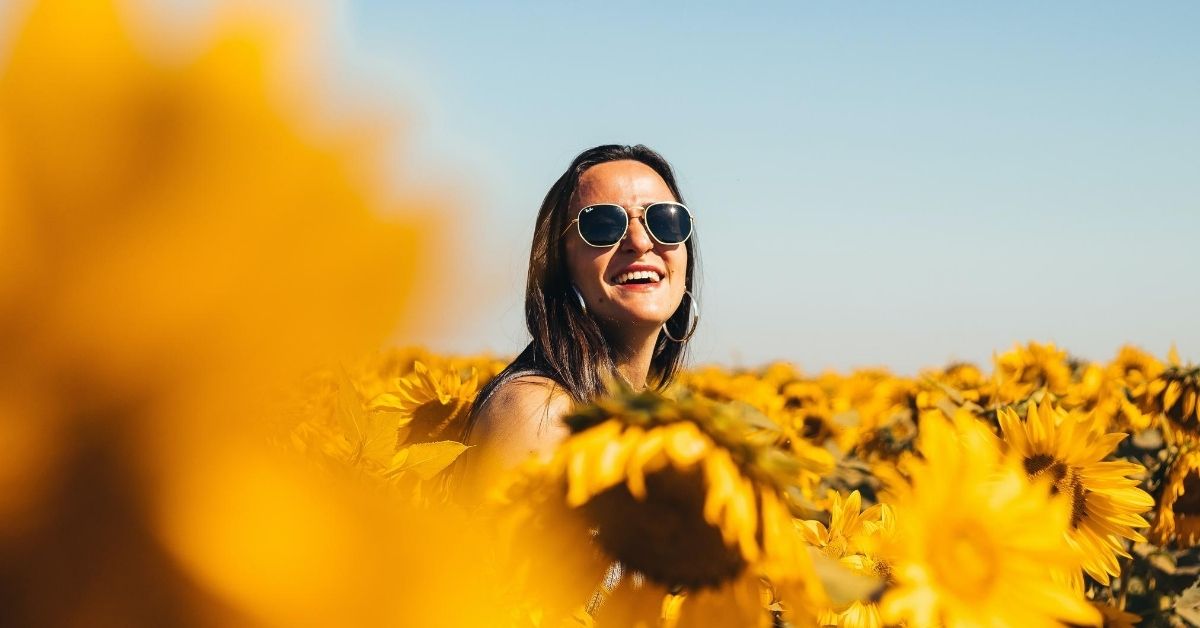 happy girl in a field of sunflowers