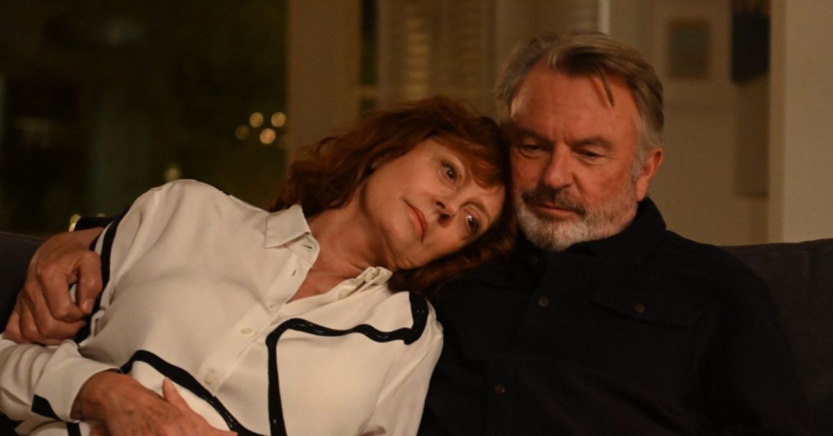 Lily played by Susan Sarandon rests her head on Paul's shoulder (played by Sam Neill)