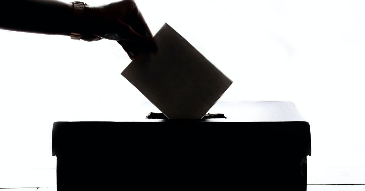 Putting vote in ballot box -