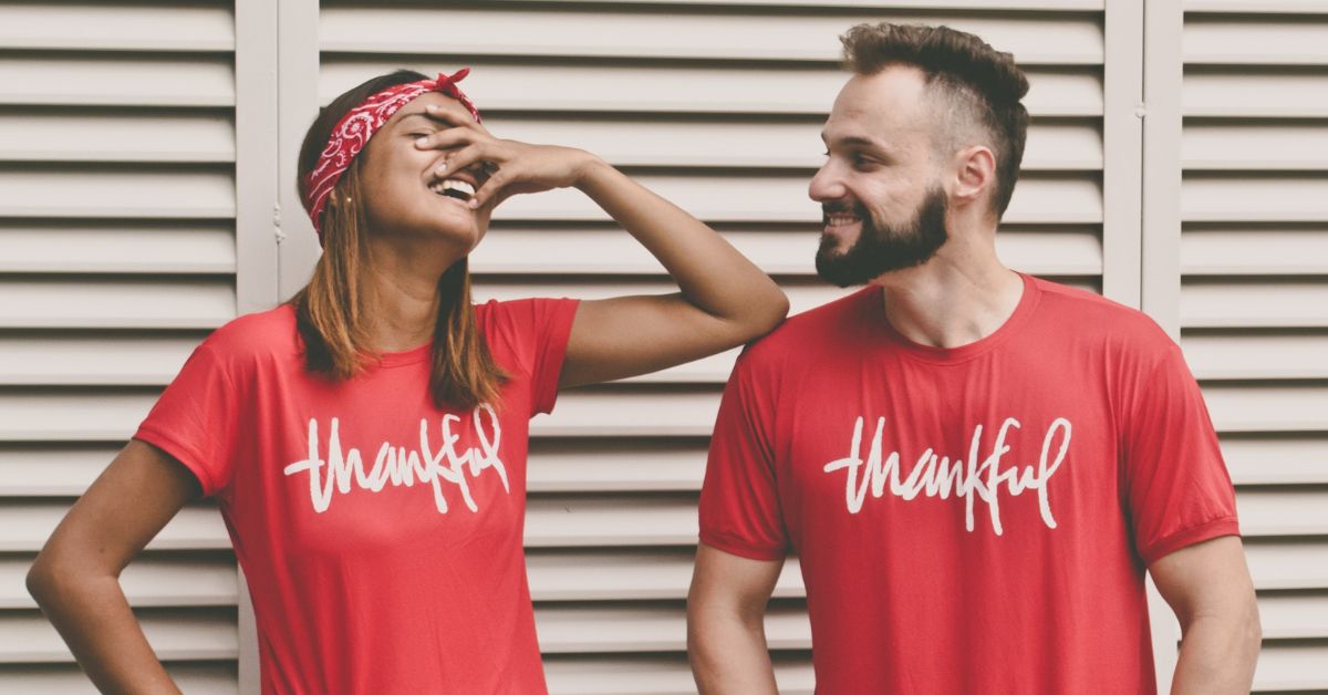 man and woman in thankful t-shirts