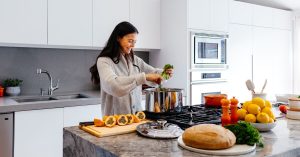 Woman cooking healthy dinner