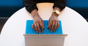 Woman typing on Laptop