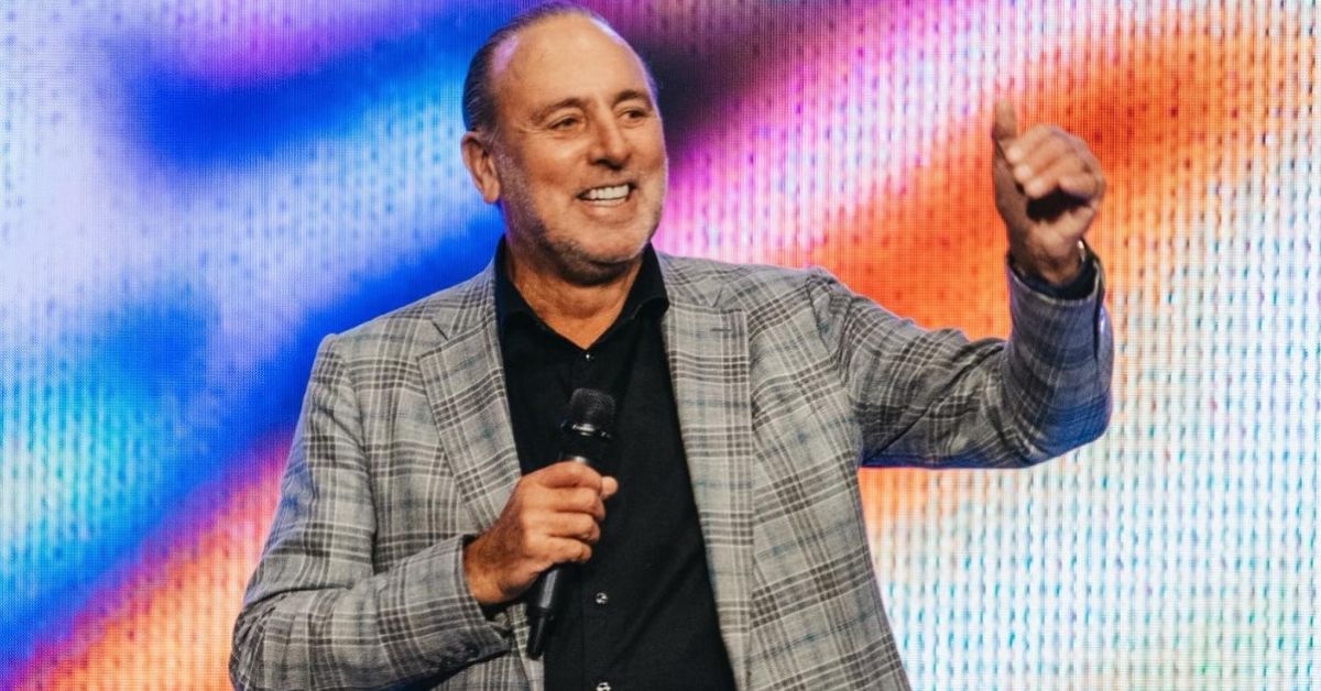Brian Houston smiling and preaching
