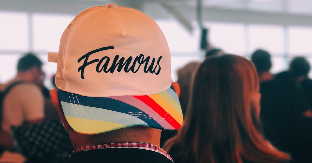 Man wearing 'Famous' Hat