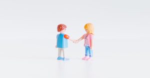 Plastic Figurines shaking hands