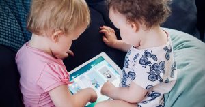 Toddlers playing on ipad