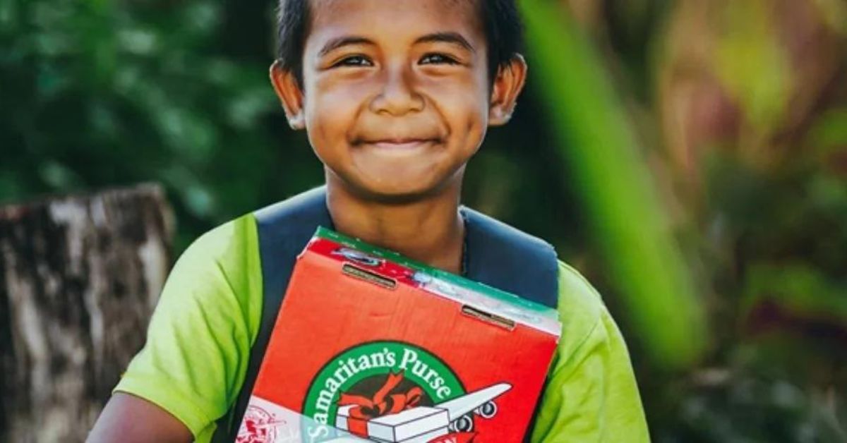 Young boy with Operation Christmas Child shoebox