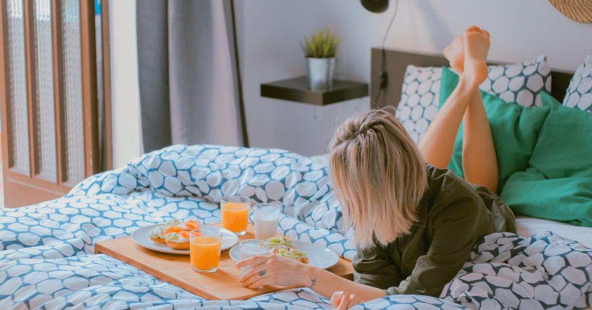 Young woman brunch in bed
