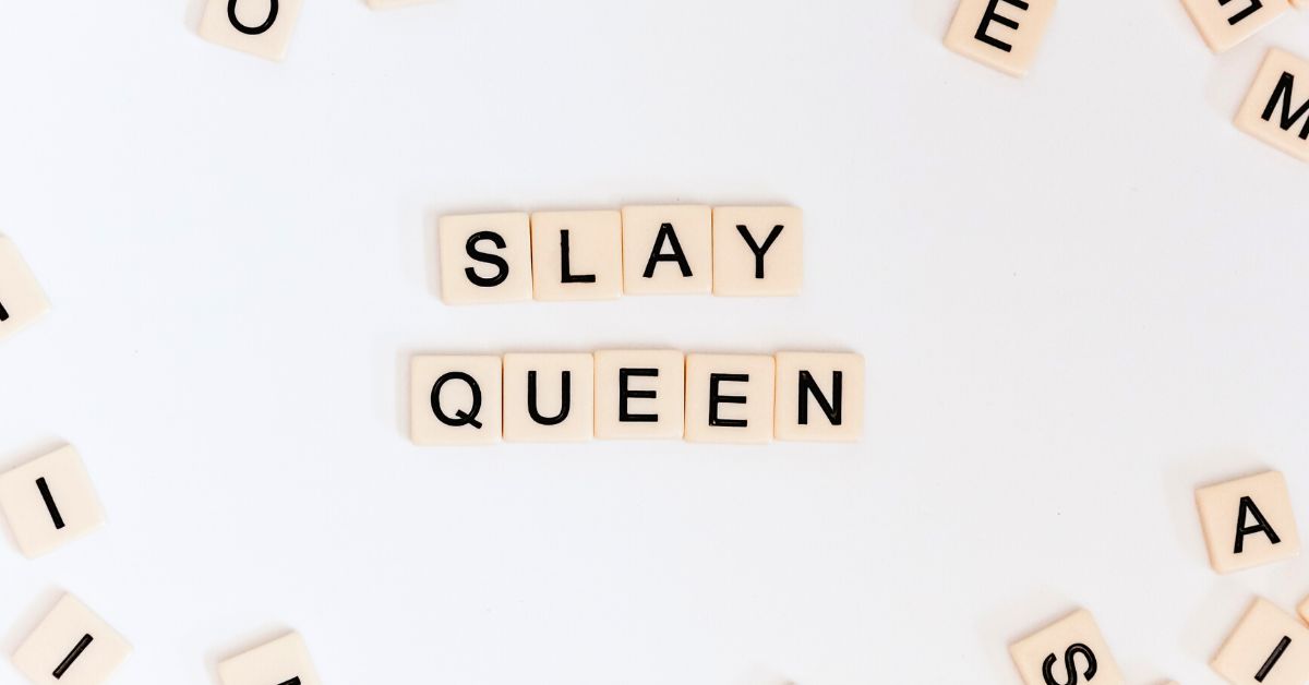 scrabble letters forming the words Slay Queen