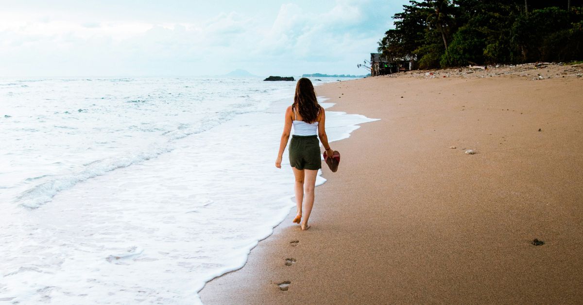 Woman walking on beach