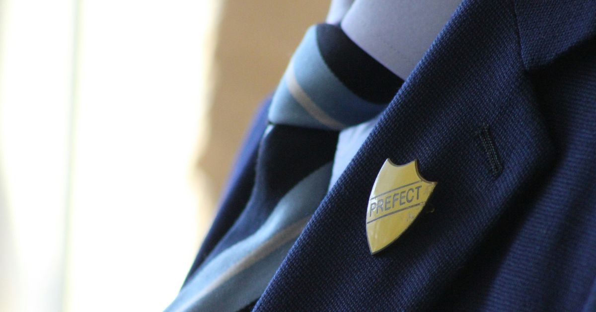 School uniform with prefect badge